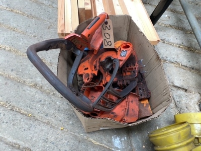Box of chainsaw parts