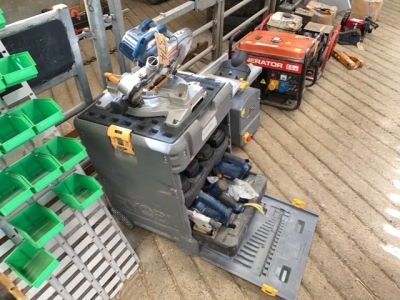 Ryobi saw on storage box with rip saw etc, drill and jig saw inside