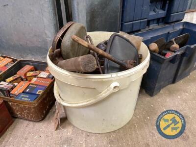 White bucket of miscellaneous items