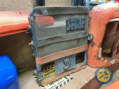 Same Laser front grill; off European tractor