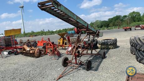 Lister bale elevator with engine belt