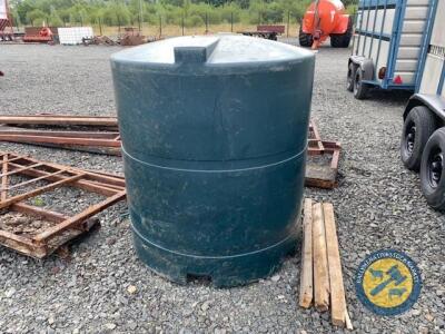 Green oil tank with hose