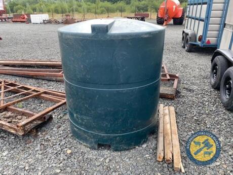 Green oil tank with hose