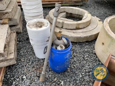 Blue barrel with various sizes of pipe fittings