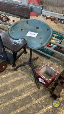 Tractor seat with cast iron stand