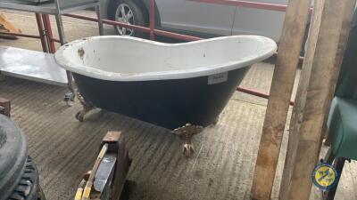 Cast iron bath with taps