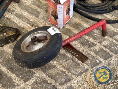 Wheelbarrow wheel on implement frame