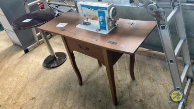 Sewing machine on table