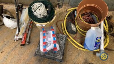 Bucket of wires and sink fittings, man hole lid