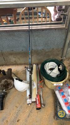 Top link, silicon gun, fishing rod, hard hat, welding rods and caravan lights