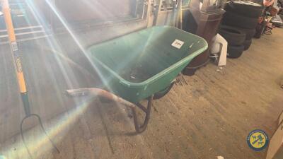 Green plastic wheelbarrow