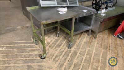 Small stainless steel table on wheels